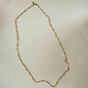 Kirks Folly beautiful gold tone long squished bar link necklace. Signed.